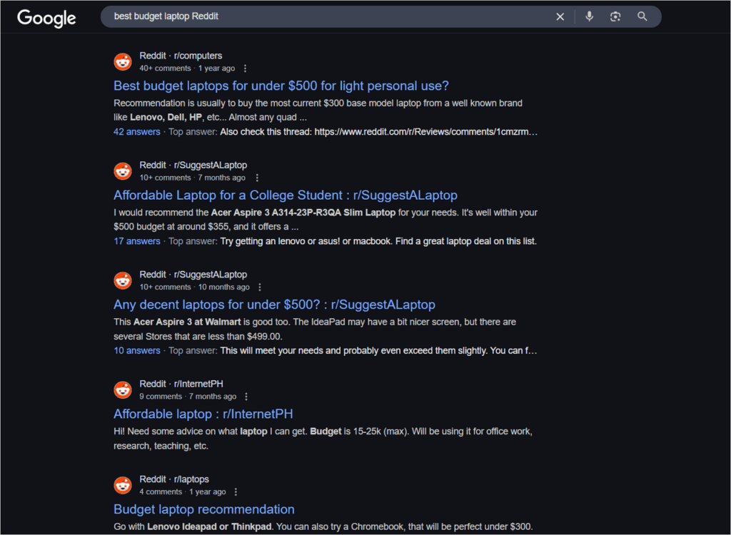 Google results page with several top listings from Reddit about budget laptop recommendations.