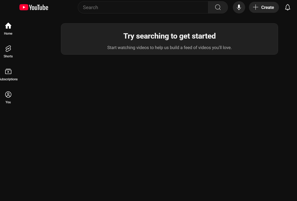 YouTube homepage shows empty feed with “Try searching to get started,” plus search bar and side menu icons.