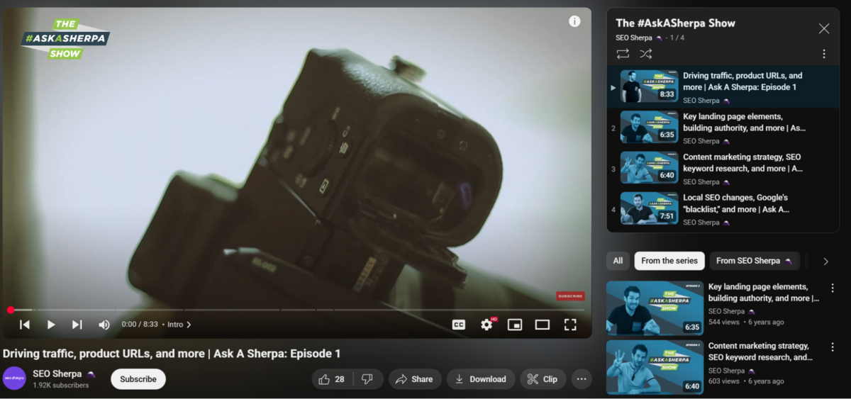 Screenshot of a YouTube playlist titled "The #AskASherpa Show" by SEO Sherpa, displaying a video in progress with the full playlist visible on the right side of the screen